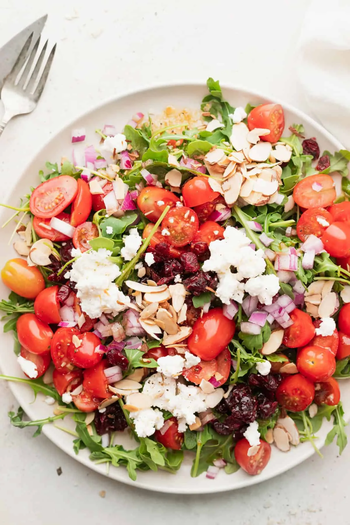Frisee Arugula Salad with Grapes, Strawberries, and Goat Cheese