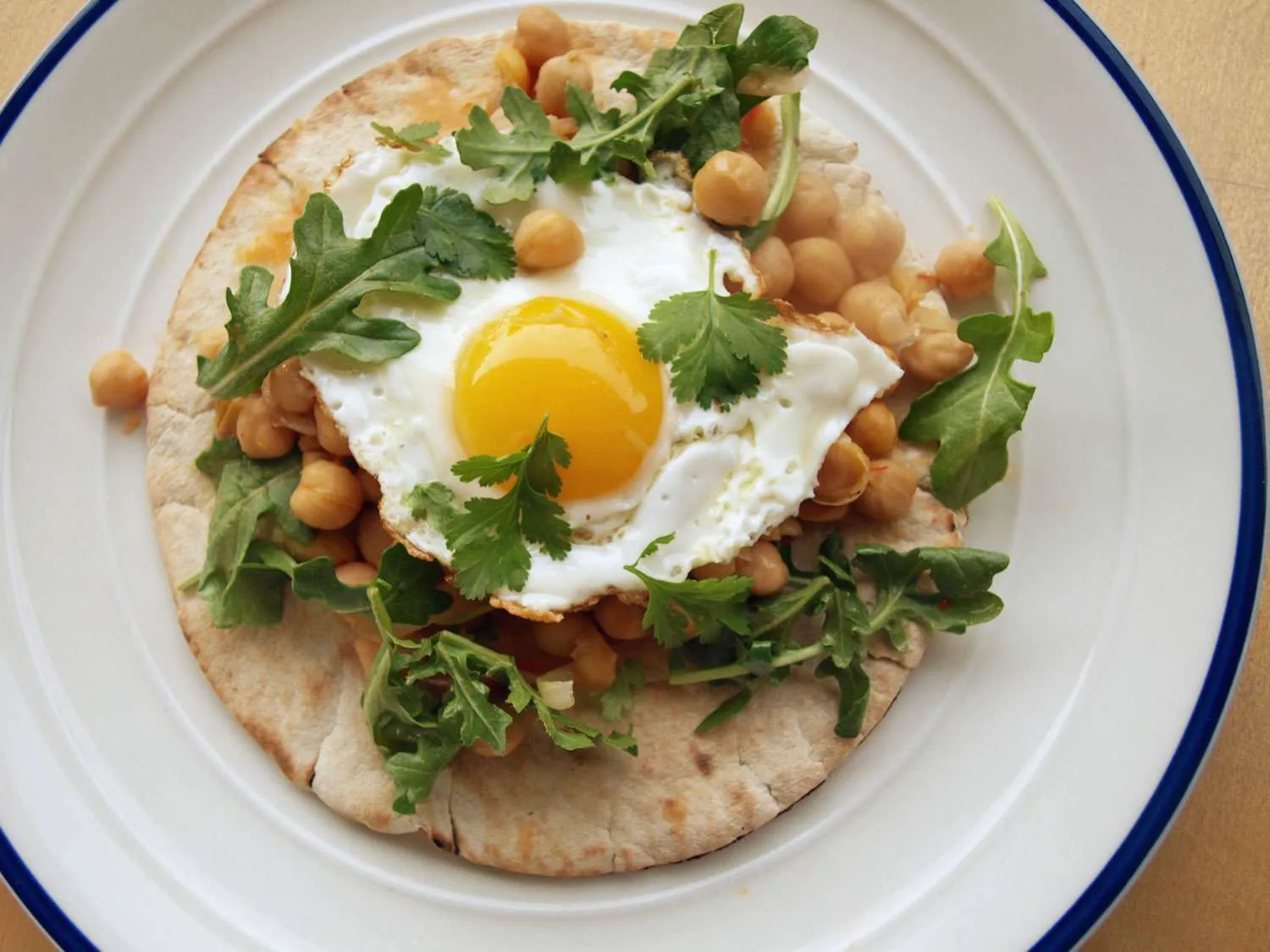 Hearty Eggs Harissa Spiced Chickpeas Mixed Greens