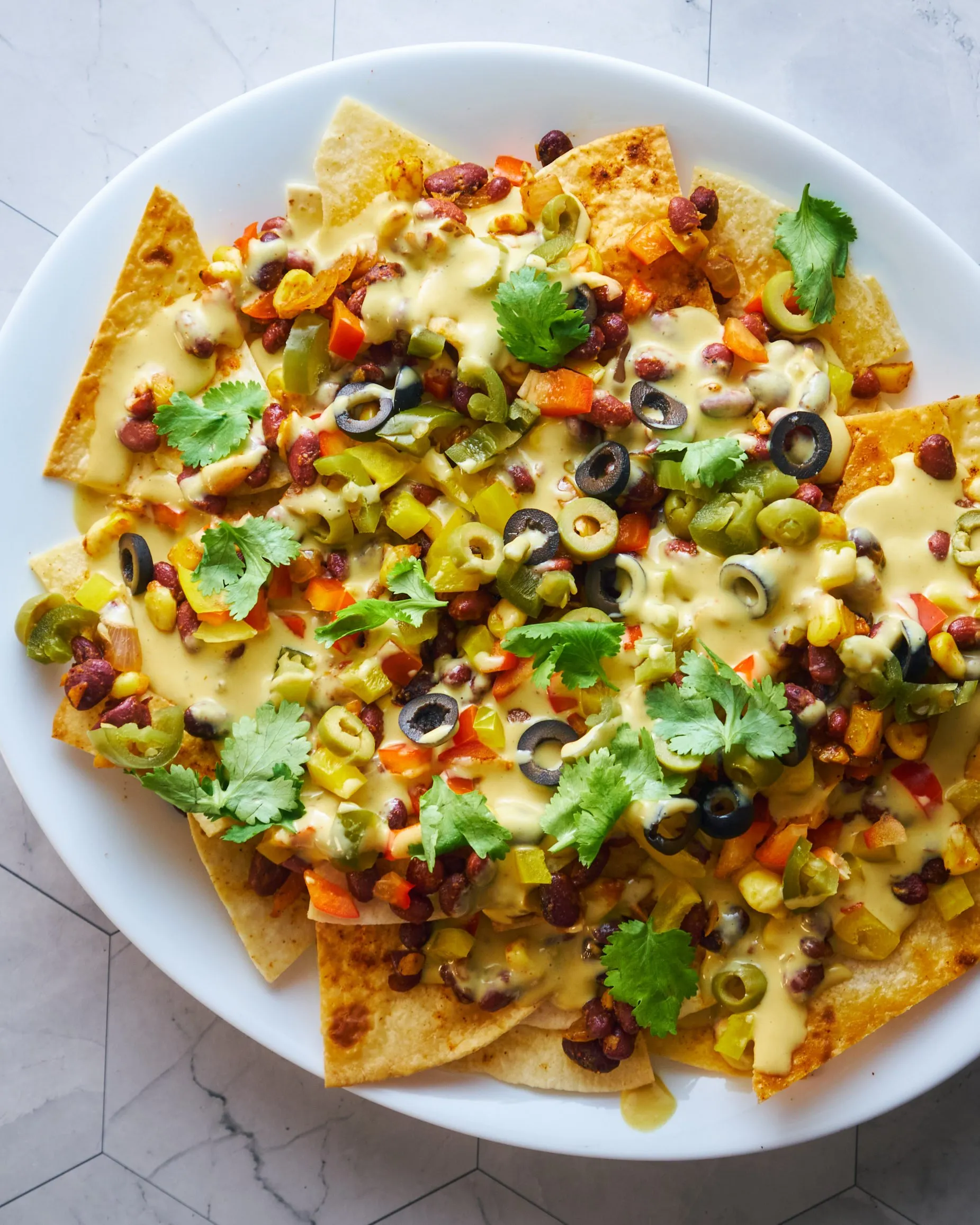 Loaded Vegan Potato Nachos with Queso