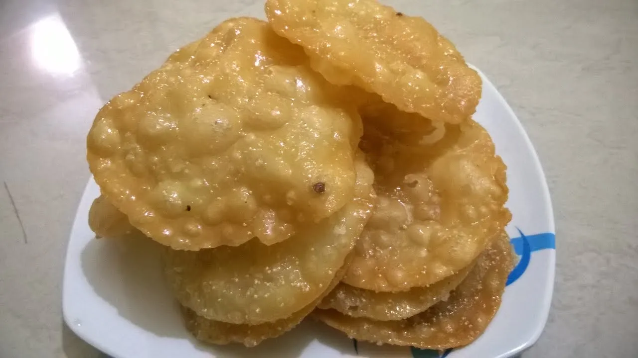 Pakatali Puri Fried Flatbread Glazed in Lemon Saffron Flavored Syrup