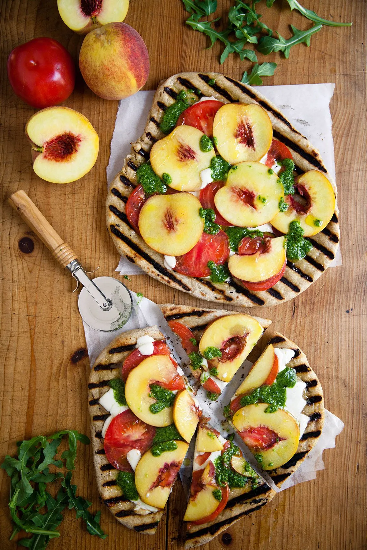 Pizza with Arugula, Peaches, and Hazelnuts
