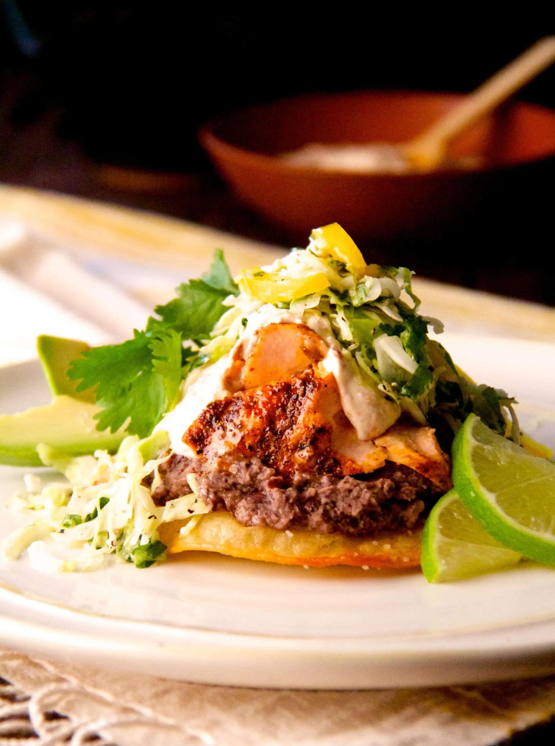Salmon and Black Bean Tostadas with Cilantro Lime Slaw and Chipotle Crema