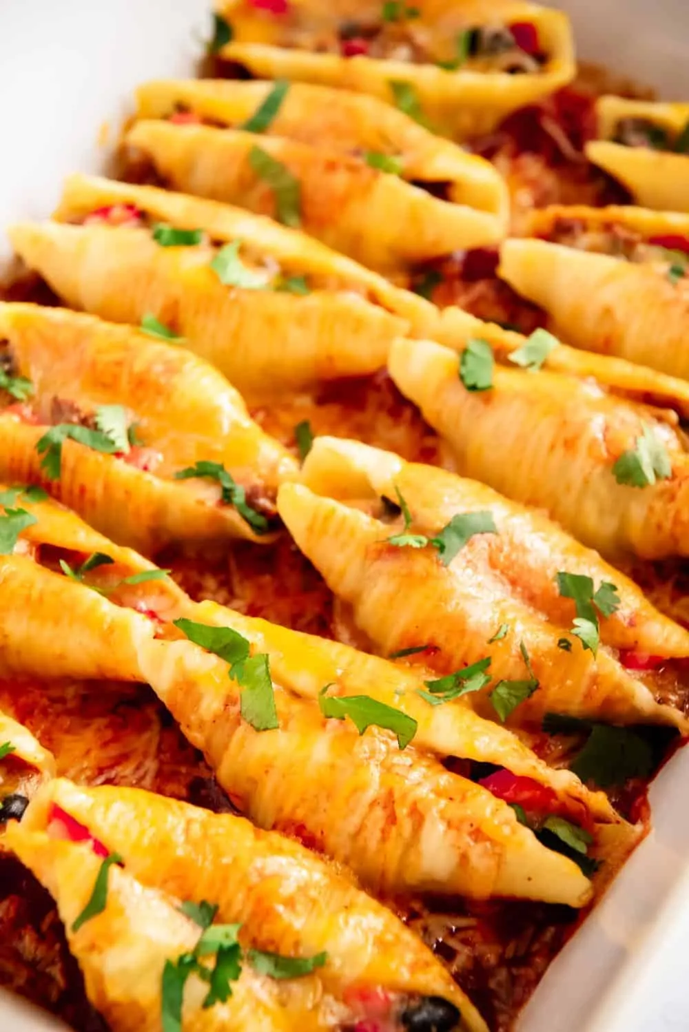 baked mexican stuffed shells with creamy green chili sauce
