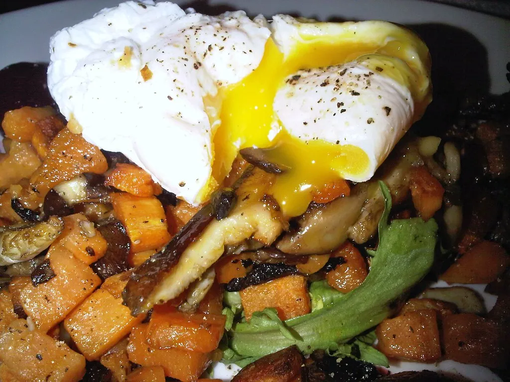 fall vegetable and quinoa hash with poached eggs