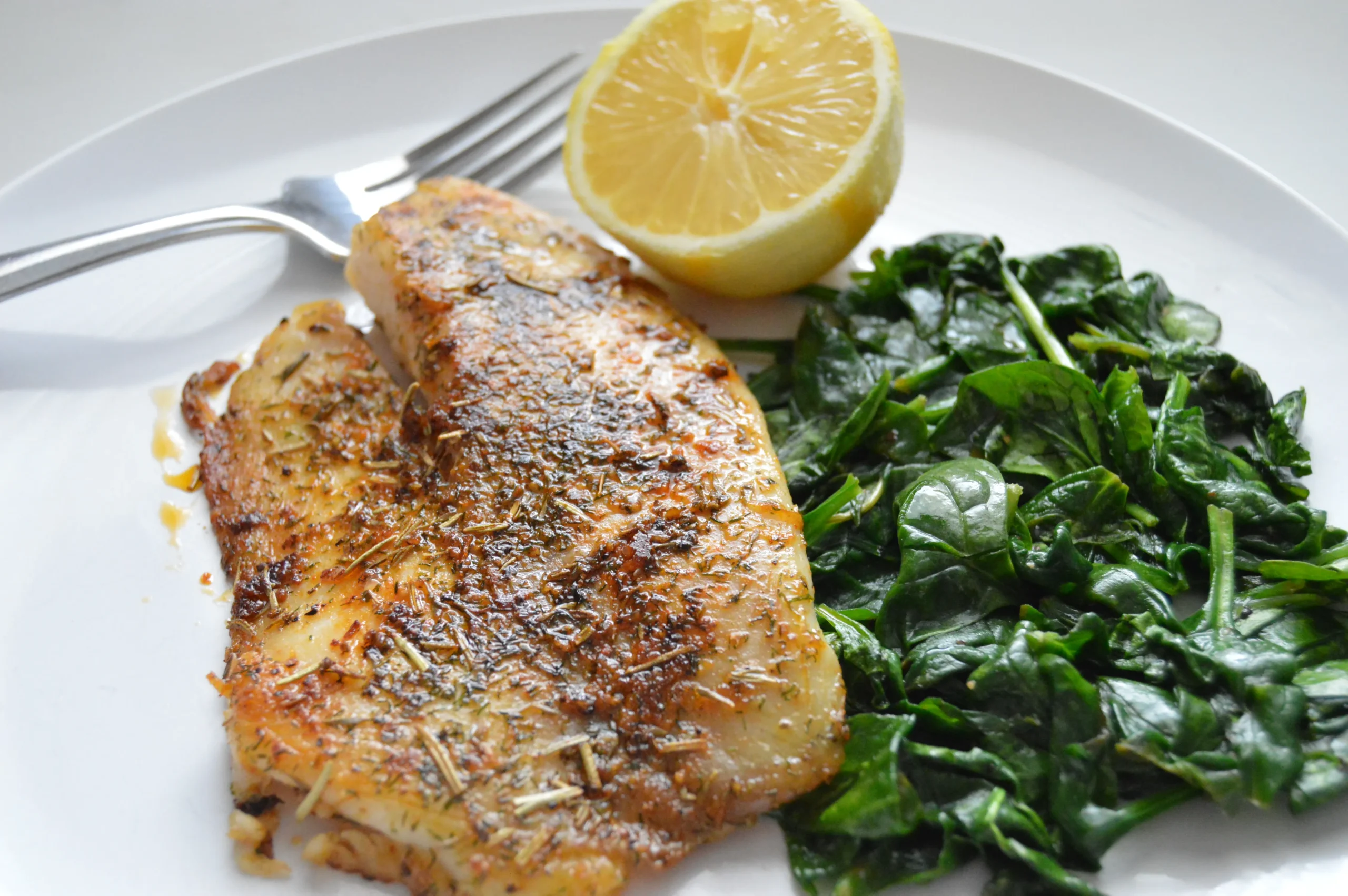 rosemary citrus tilapia with baby spinach salad